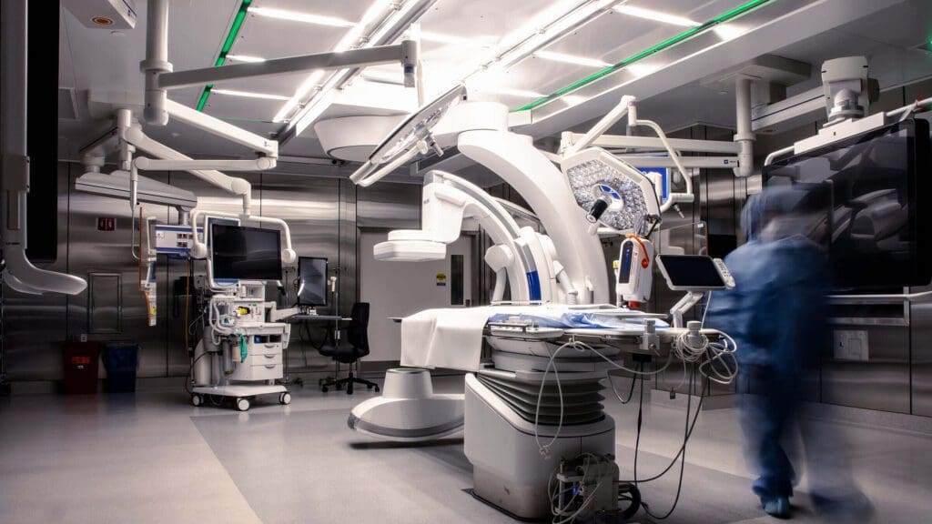 Modern medical imaging equipment in a high-tech hospital room.